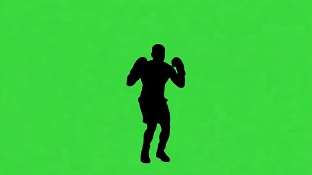Silhouette Boxer Celebrating Victory on Green Screen - A black silhouette of a boxer stands against a bright green screen background, fists raised in a celebratory pose.
