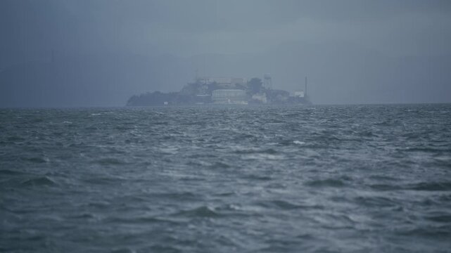 Alcatraz Island In San Francisco Bay With Choppy Waves With Stormy Overcast Sky