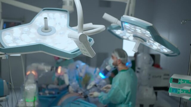 Surgical surgery health care team operating in operation room. Surgeons in hospital performs surgical procedures. Team of doctors processing surgical operation in modern emergency.