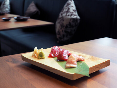 Fresh raw tuna or otoro, chutoro and akami sushi sashimi served with pickled ginger and wasabi. Japanese traditional food. Selective focus.