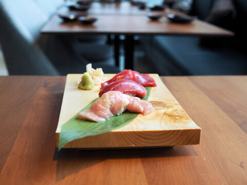 Fresh raw tuna or otoro, chutoro and akami sushi sashimi served with pickled ginger and wasabi. Japanese traditional food. Selective focus.