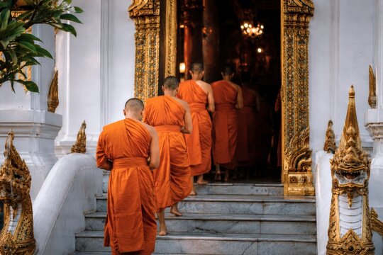Thai monk ordination daily monastic life in temple stairway with orange robe and sacred architecture