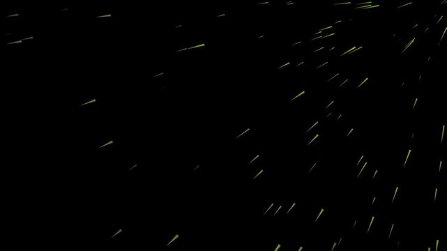 Bright yellow light sparks flying and exploding in the darkness creating a dynamic abstract motion effect for creative graphic design projects