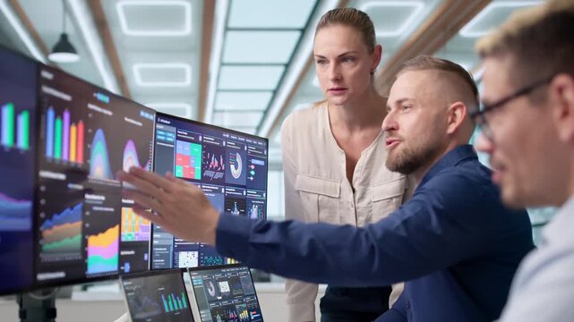 Data Analysts In Office Reviewing Financial Dashboards