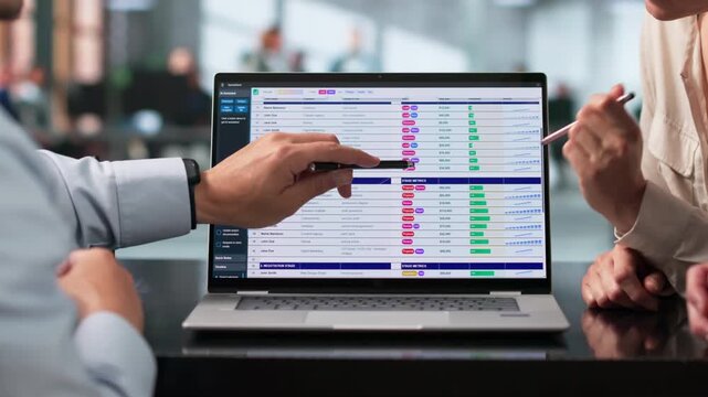 Billing Analyst And Team Reviewing Coding Spreadsheets