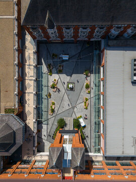 London, England, United Kingdom - 23 June 2026: Aerial view of Ealing Broadway showing the pedestrian plaza with geometric paving, seating, and a central soccer ball sculpture.