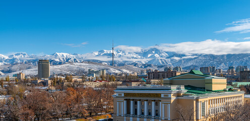 A picturesque view of the Kazakh city of Almaty on an autumn day after the first snow.