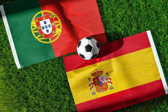 Portugal vs Spain, Round of 16, national flags before international football match, football on green grass with stadium in the background