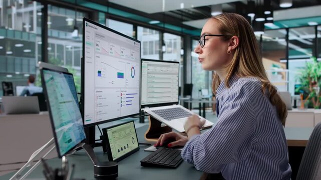 Insurance Adjuster Reviews Claim Status Using Laptop