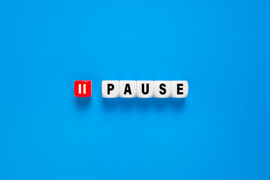 pause word with button symbol. isolated on blue background