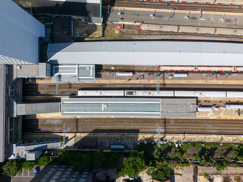 London, United Kingdom - 24 June 2026: Aerial view of Ealing Broadway Station with multiple train platforms, tracks, and modern station architecture.