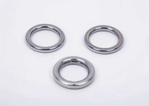 Three silver o-rings on a white background isolated on a transparent background metal circular