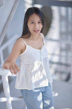 Young Woman Posing in Natural Light with Soft Shadows and Soft Focus