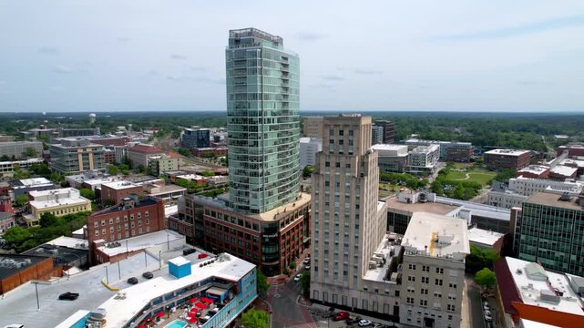 Aerial view of downtown durham north carolina cityscape on a bright and sunny day with modern and traditional architecture.