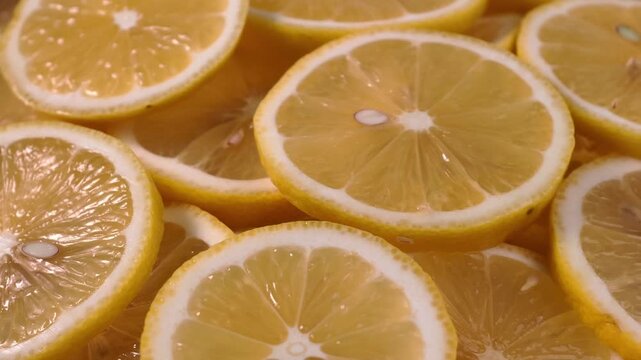 Close up display of fresh yellow lemon slices 