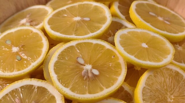 Close up display of fresh yellow lemon slices 