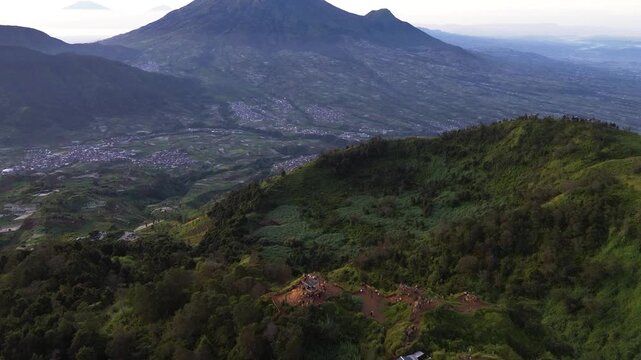 Aerial Drone View of Sikunir Hill Hiking Trail at Dawn with Mount Sindoro and Mount Sumbing, Indonesia