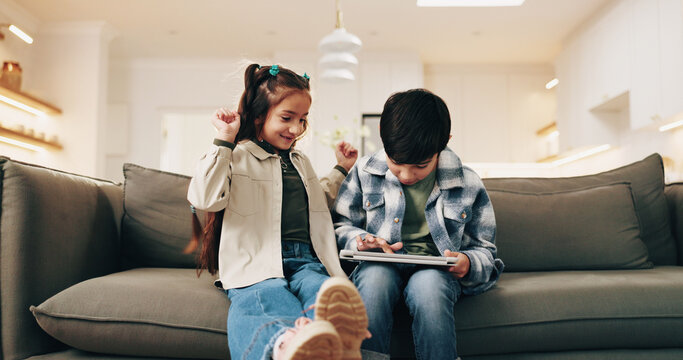 Celebration, fist pump and siblings with tablet on sofa in home living room for education games. App, brother and sister in apartment together for child development learning or winning as family