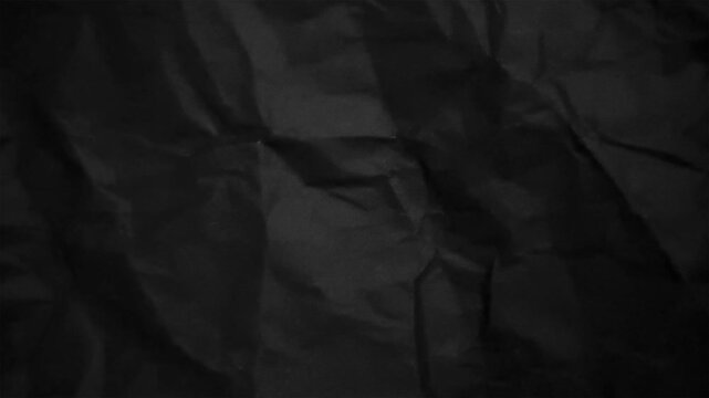 Abstract black papers crumpled texture motion backgrounds