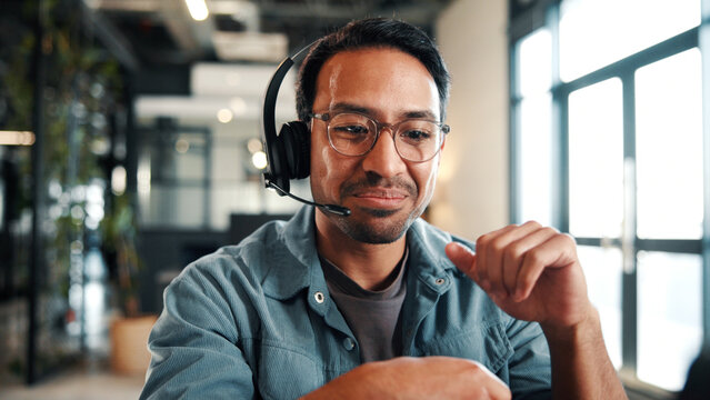 Call center, man and headset in customer support with help desk, communication and online consultant. Contact us, technology and conversation with web service, virtual advice or agent for hotline