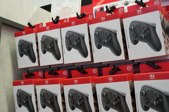 Nintendo Switch 2 Pro controllers in retail packaging on a store shelf.
