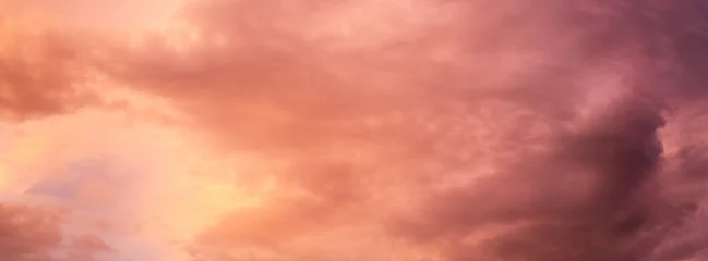 Fototapeten Coral Dramatic sunset over a dark landscape with fiery clouds, atmospheric sky view, moody natural scenery, intense color contrast, evening atmosphere  © ketrin