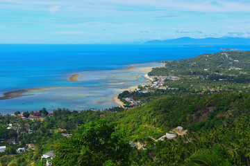 Fototapeta premium Koh Samui, Thailand - June 27, 2026: Viewpoint Overlap Stone 2, Lamai Beach, Koh Samui, Thailand. Shot From The High Point Of View on the edge of a mountain slope. Seascape Seen from Overlap Stone is