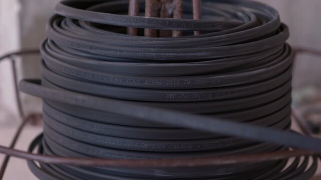 Coil of electrical cable on reel at construction site
