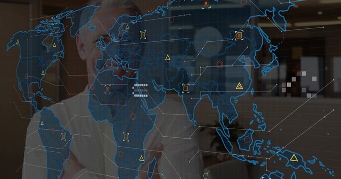 Senior male business exec uncrossing arms as holographic map fading in, reviewing Asia market data