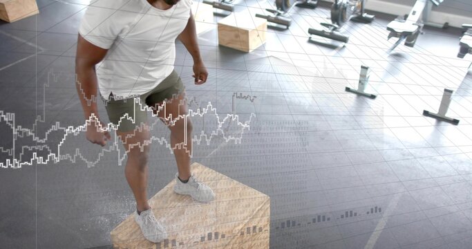 Man tapping chalk then executing and landing box jump, animated path and power metrics for fitness