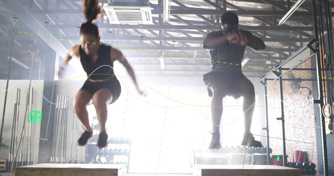 Two athletes squatting and exploding into box jumps for gym training, motion lines tracing paths
