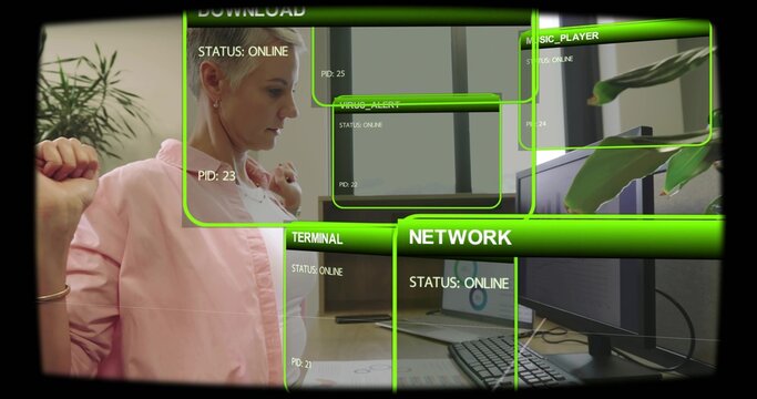 Woman pausing, stretching after work, resuming typing as HUD overlaying screens showing tech charts