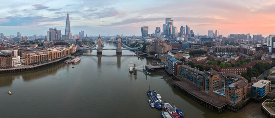 Aerial Panorama of River Thames, Historic Tower Bridge, and London Skyline at Sunrise