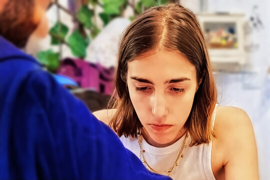 Young woman with mobile phone at home