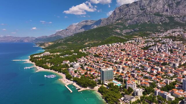 View of Makarska Croatia with coastal area and mountainous background during daylight