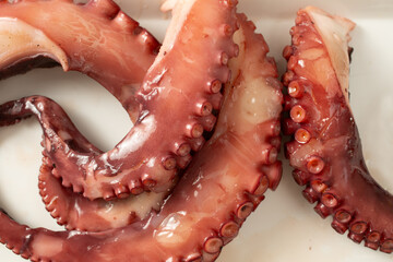 A top down view of a pile of boiled octopus tentacles. © DAVID