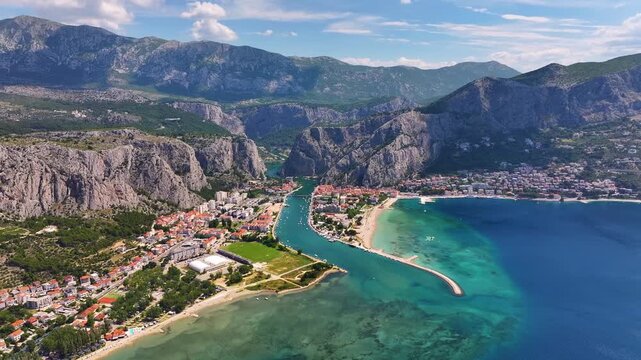 Omis Croatia shows coastline, river, mountains, and urban area during daytime with clear skies