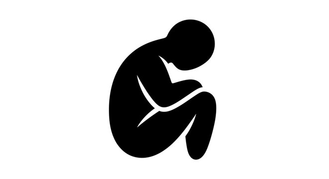 Silhouette of person curled up in fetal position, conveying isolation and sadness