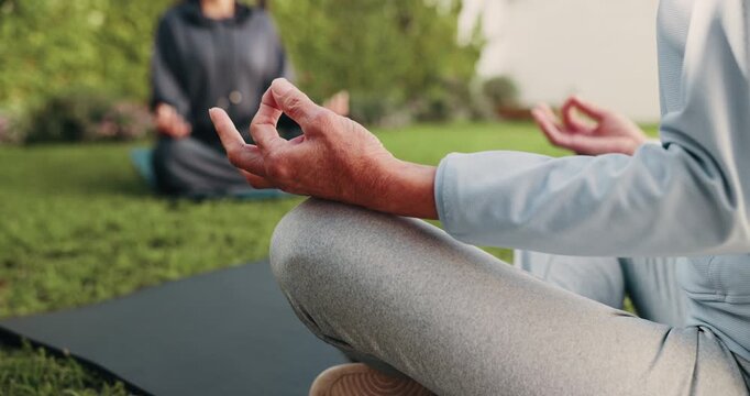 Meditation, senior or hands with teacher in nature for spiritual wellness or outdoor mindfulness. Elderly, instructor or lotus pose with zen or lesson on yoga mat for chakra, mudra or balance in park