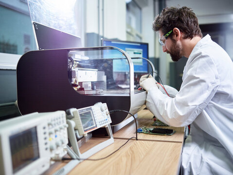 Technician checking 3D printer