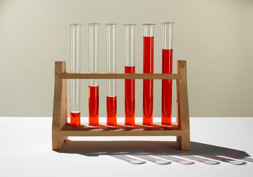 Test tubes with red liquid representing an ascending bar chart