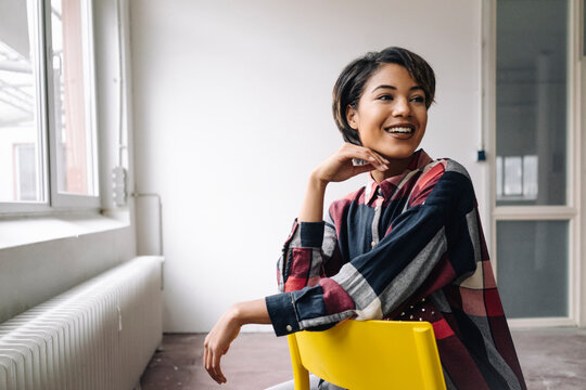 Smiling woman sitting on chair