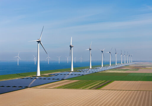 Wind turbines and solar panels at IJsselmeer in the Netherlands