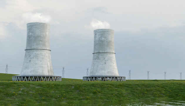 Modern nuclear power plant with cooling tower in a green landscape