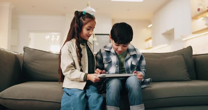 Children, siblings and tablet for win in home, entertainment game and bonding together on weekend. Kids, tech and relax on sofa for gaming success, play and click for online achievement with level up