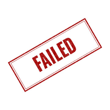 Red failed rubber stamp text on a flat surface