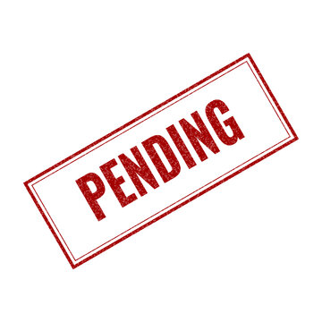 Red pending rubber stamp mark on document