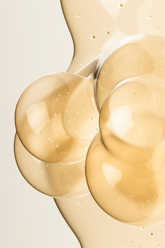 3D cosmetic serum molecule with golden skincare texture