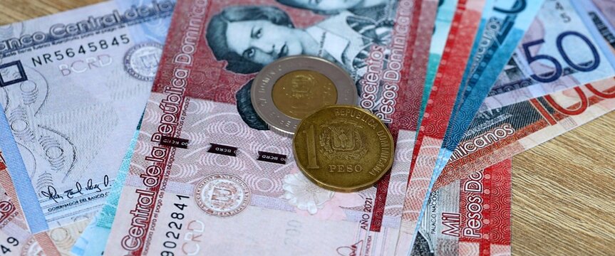 Dominican peso money bills and coins on table. Dominican Republic cash of DOP currency