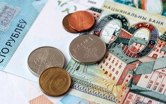 Belarusian ruble money bills and coins on table. Belarus cash of BYN currency close up